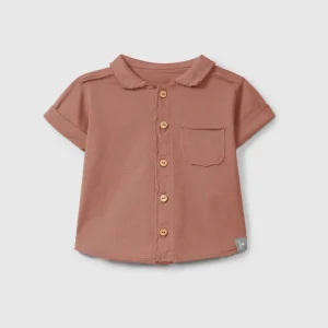 Polo in jersey tinta unita con taschino