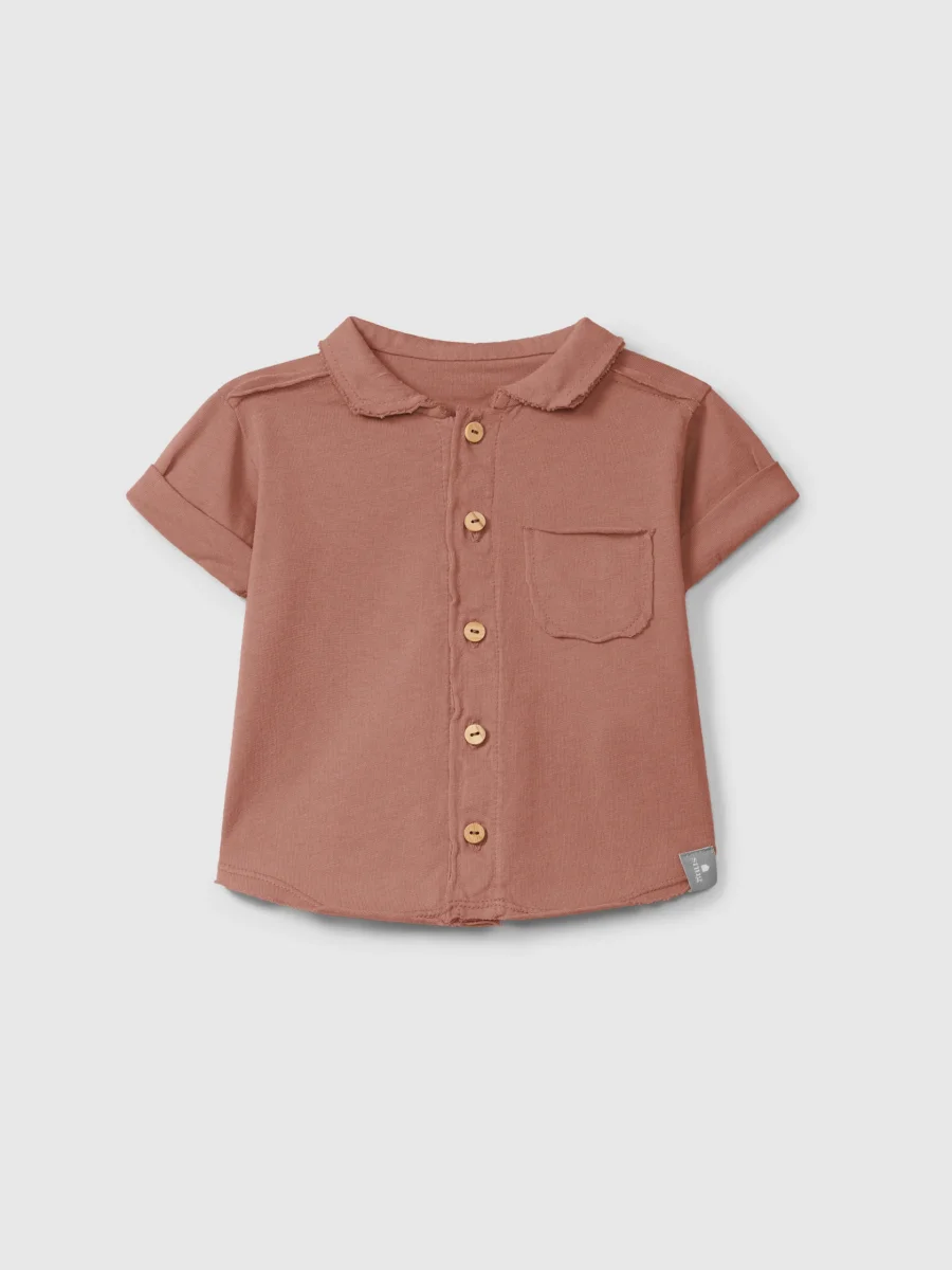 Polo in jersey tinta unita con taschino